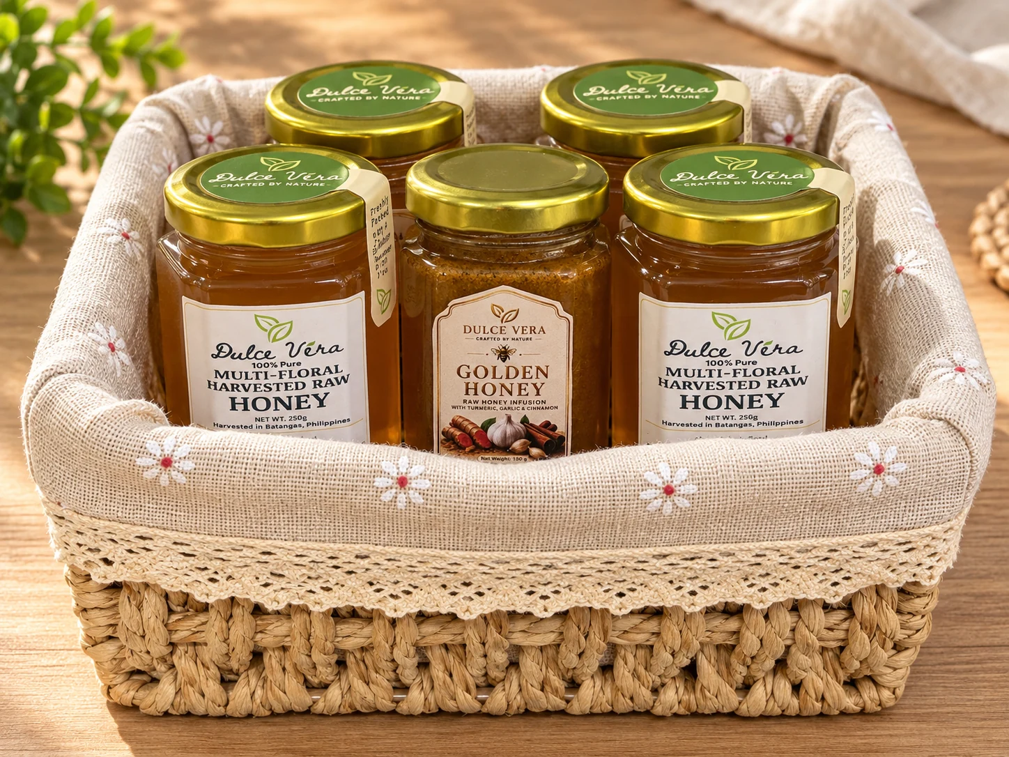 Styled concept of five upright honey jars in a white fabric-lined woven basket
