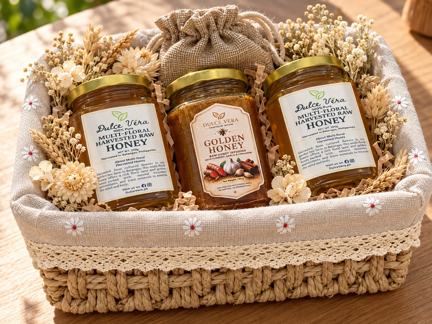 Styled concept of three honey jars placed on natural kraft cushion with neutral dried blossoms